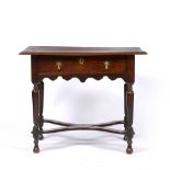 A WILLIAM AND MARY WALNUT AND OAK CROSS BANDED SIDE TABLE fitted with frieze drawer and two brass