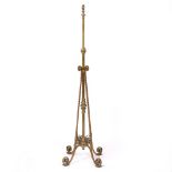 A VICTORIAN CAST BRASS HEIGHT ADJUSTABLE LAMP STANDARD converted for electric use with four