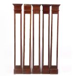 A GROUP OF FIVE VICTORIAN MAHOGANY FRAMED NARROW MIRRORS or architectural pilasters, each 24cm x