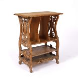 AN ANTIQUE CARVED PINE MUSIC STAND the rectangular top and vertical and horizontal compartments