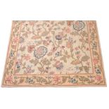 A KASHMIR CREWELWORK HANGING wool on linen with a wide floral border and decorated with exotic