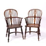A PAIR OF 19TH CENTURY ASH AND ELM LOW BACK WINDSOR ARMCHAIRS with pierced splats, saddle seats,