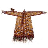 AN ANTIQUE EMBROIDERED COAT possibly Uzbek, with applied scrolling designs to a purple ground in