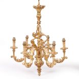 A GILT SIX LIGHT ELECTROLIER in the Rococo manner with acanthus leaf decorated scrolling branches,