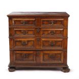 A LATE 17TH CENTURY WALNUT CHEST OF TWO SHORT AND THREE LONG DRAWERS with mitred draw front, cast