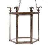A GEORGIAN STYLE BRASS HEXAGONAL HALL LANTERN with eagle finials and fluted column decoration to