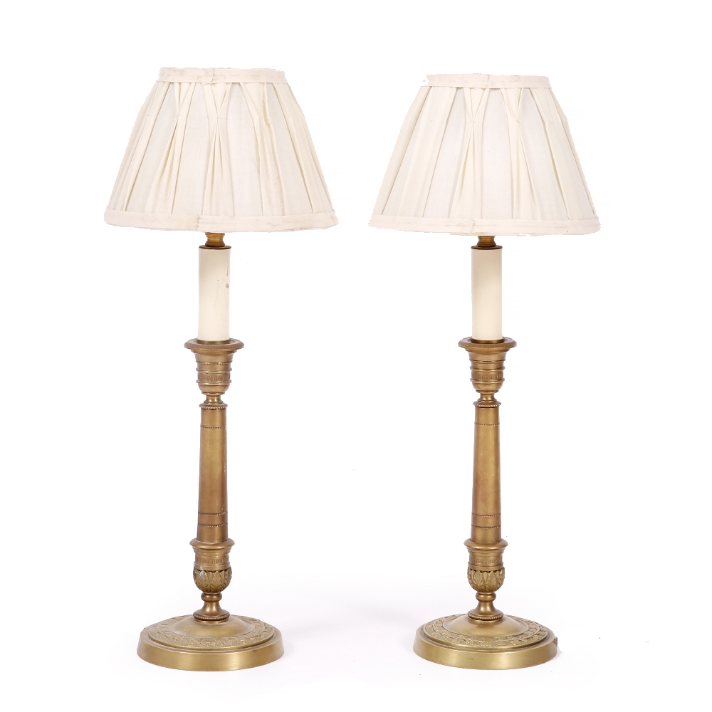 A PAIR OF CONTEMPORARY CAST BRASS TABLE LAMPS each with pleated shade, 51cm high