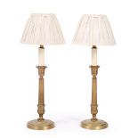 A PAIR OF CONTEMPORARY CAST BRASS TABLE LAMPS each with pleated shade, 51cm high