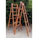 A PAIR OF FOLDING TRESTLES painted 'H.J. Knapp & Sons Limited, Standstead in the Vale', 233cm