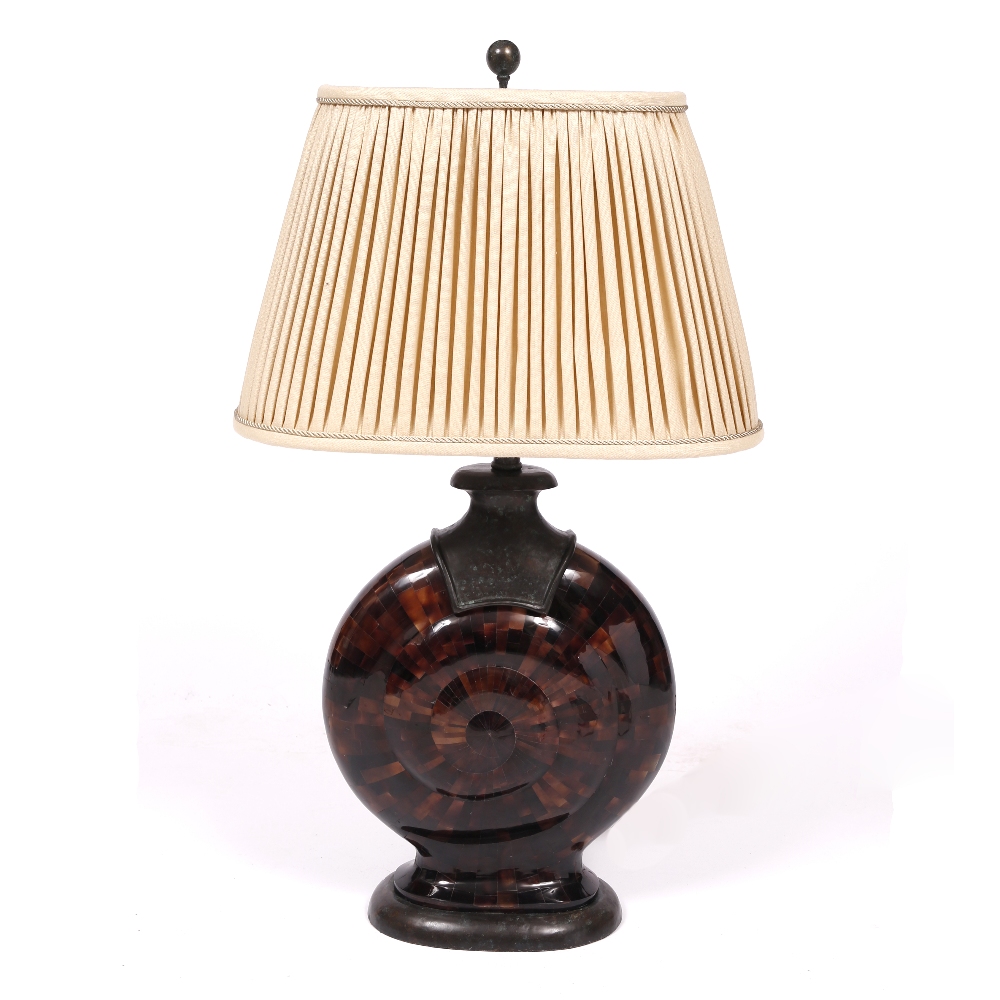 A DECORATIVE TABLE LAMP with bronze and resin base in the form of a shell and with pleated oval