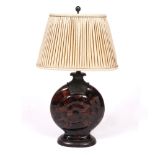 A DECORATIVE TABLE LAMP with bronze and resin base in the form of a shell and with pleated oval