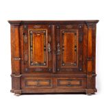AN 18TH CENTURY DUTCH SIDE CABINET in oak with ebony and blind fretwork decoration to the panel