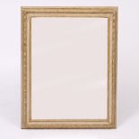 A GILT PAINTED DISTRESSED WALL MIRROR with bevelled edge mirror plate, 94cm x 73cm