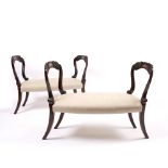 A PAIR OF 19TH CENTURY STAINED BEECH AND UPHOLSTERED WINDOW SEATS each with brass inlay and