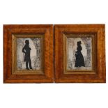 A PAIR OF SILHOUETTE PICTURES / PRINTS in maplewood frames with a label to the reverse reading '