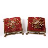 A PAIR OF VICTORIAN GILT METAL FOOT STOOLS each with overstuffed upholstered red velvet cushions