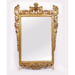 AN 18TH CENTURY STYLE CARVED GILTWOOD PIER GLASS or mirror with scrolling acanthus leaf decorated