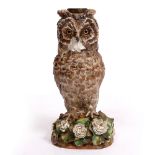 A VICTORIAN PORCELAIN OIL LAMP BASE moulded and painted in the form of a tawny owl resting on a