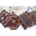 A SMALL GROUP OF TEXTILES AND CUSHIONS consisting of four Kelim covered cushions together with