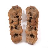 A PAIR OF INDIAN HARDWOOD CARVINGS depicting deities on the back of tigers, each approximately