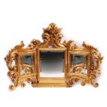 A GILT FRAMED HINGED THREE PART DRESSING TABLE MIRROR with acanthus leaf scroll decoration and