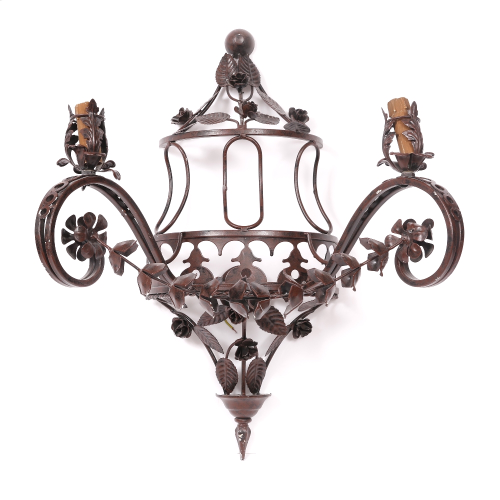 A PAIR OF BURGUNDY PAINTED WROUGHT IRON TWO BRANCH WALL LIGHTS decorated with roses and floral
