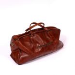 AN OLD LEATHER HOLDALL with canvas interior, 65cm wide