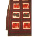 AN INDIAN BEDSPREAD with applique decoration of elephants in compartments, 262cm x 215cm