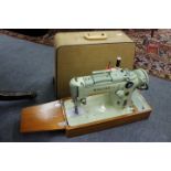 A SINGER SEWING MACHINE number 319K together with a sewing table