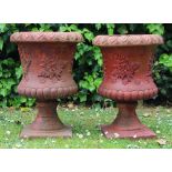 A PAIR OF SANKEY BULWELL PAINTED TERRACOTTA URNS with fern decoration relief, 51cm high (2)