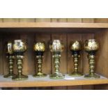 SIX GILT PAINTED GLASS GOBLETS with gilt painted decoration and shaped prunts on knopped stem,