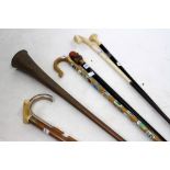 A 19TH CENTURY COPPER COACHING HORN and a selection of walking sticks or walking canes, including