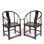 A PAIR OF CHINESE HARDWOOD CHAIRS with horseshoe backs, each 66cm wide