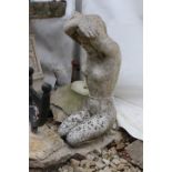 A COMPOSITE STONE BIRD BATH in the form of a female figure, 65cm in height