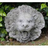 A RECONSTITUTED STONE LION MASK WALL FOUNTAIN with flaring mane, 39cm high x 39cm wide