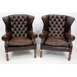 A PAIR OF GEORGIAN STYLE RED LEATHER UPHOLSTERED WING BACK ARMCHAIRS 82cm wide