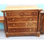 A VICTORIAN MAHOGANY SCOTCH CHEST fitted with three short and three long drawers, turned columns
