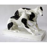 A GOLDSCHEIDER AUSTRIAN PORCELAIN FIGURE GROUP OF DOGS signed and marked to the base, 29cm x 20cm