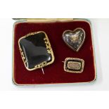 THREE LATE VICTORIAN / EARLY EDWARDIAN MOURNING BROOCHES one large oblong example, one enamel and