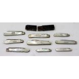 A SELECTION OF ANTIQUE MOTHER OF PEARL HANDLED FOLDING FRUIT KNIVES to include one cased example