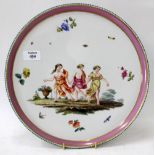 A 19TH CENTURY BERLIN PORCELAIN CIRCULAR TRAY decorated with the three graces within a pink