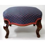 A VICTORIAN MAHOGANY FOOTSTOOL with a purple and pink upholstered top 36cm across