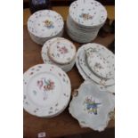 AN EXTENSIVE K.P.M PORCELAIN DINNER SERVICE with hand painted floral decoration