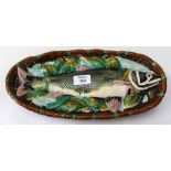 A 19TH CENTURY MINTON MAJOLICA WALL HANGING OR PLAQUE depicting a fish on a bed of leaves, 36cm
