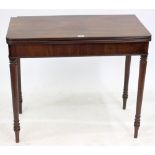 A LATE 18TH / EARLY 19TH CENTURY MAHOGANY FOLD OVER TOP CARD TABLE standing on tapered ring turned