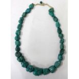 A TURQUOISE NECKLACE consisting of stones of various sizes