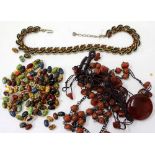 A SMALL SELECTION OF ETHNIC STYLE COSTUME JEWELLERY to include necklaces, unmarked gilt metal and