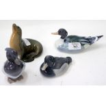 A GROUP OF THREE ROYAL COPENHAGEN PORCELAIN BIRDS together with a seal (4)
