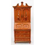 AN ORANGE AND GOLD PAINTED BUREAU BOOKCASE with twin doors above fall front and three drawers raised