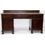 A REGENCY MAHOGANY SIDEBOARD with shaped panelled doors standing on paw feet, 199cm x 105cm x 76cm